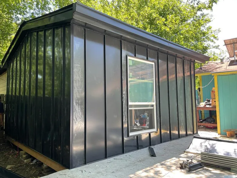 Black standing seam metal wall panels for Roof Inspection in Raleigh Hills